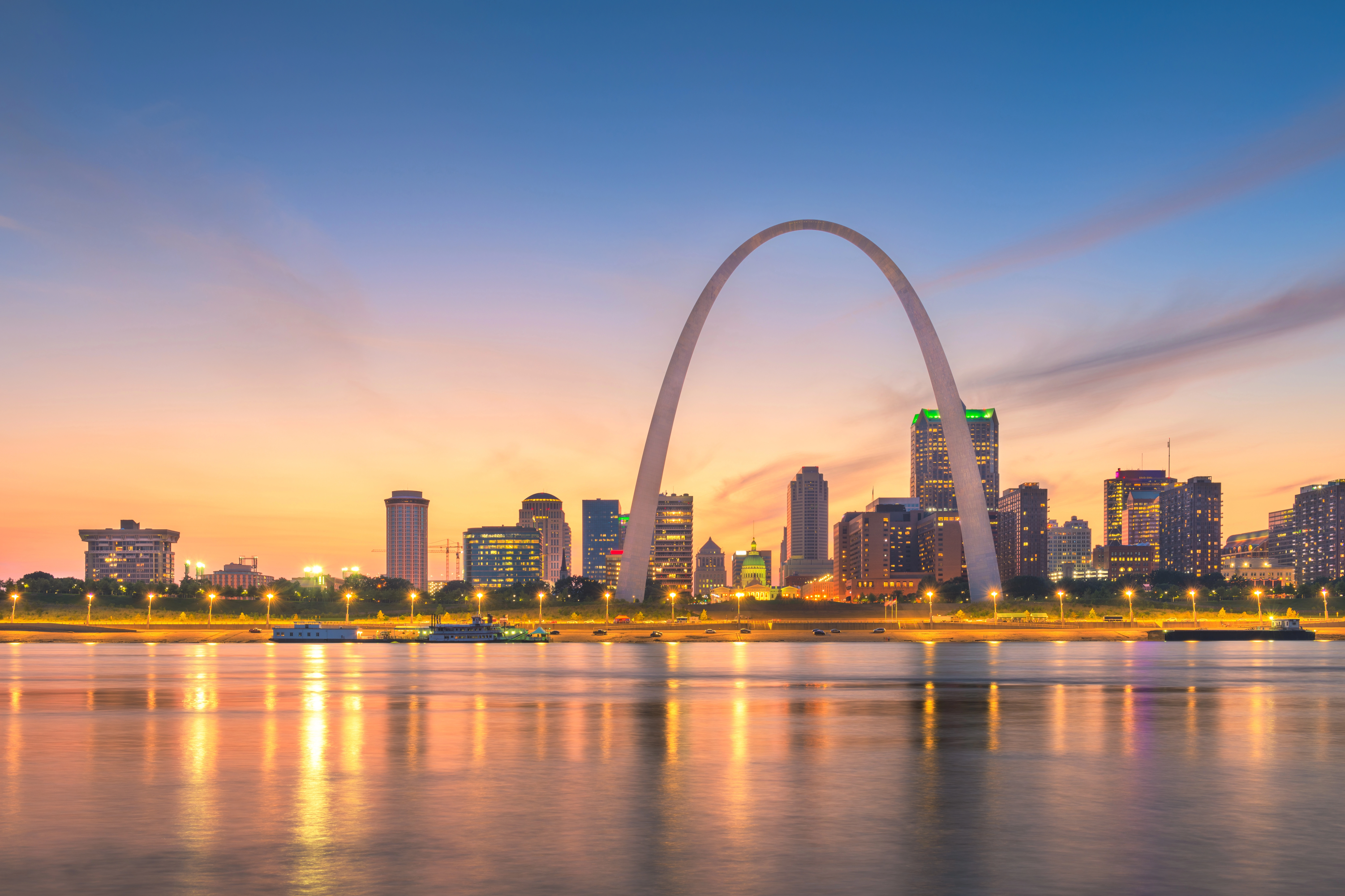Professional locksmith service map showing coverage across 40+ cities in Missouri and Illinois - St. Louis Gateway Arch at sunset